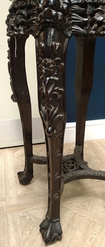 Lot 672 - An Oriental carved and pierced hardwood stand...