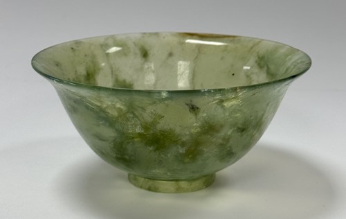 Lot 67 - A Chinese turned mottled green jade bowl, early 20th century