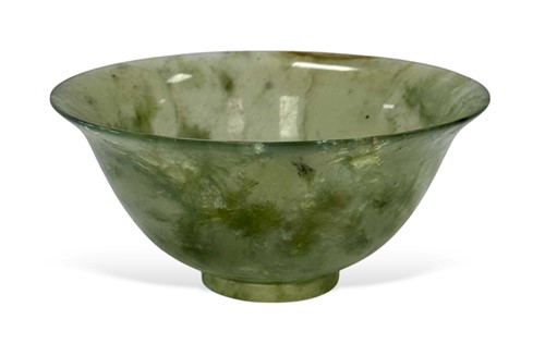 Lot 67 - A Chinese turned mottled green jade bowl, early 20th century