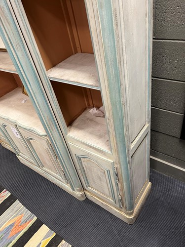 Lot 469 - A French provincial style painted breakfront bookcase