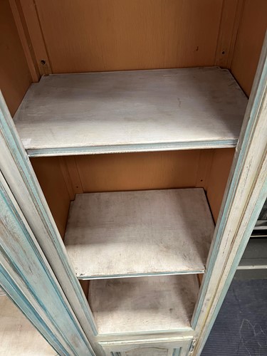 Lot 469 - A French provincial style painted breakfront bookcase