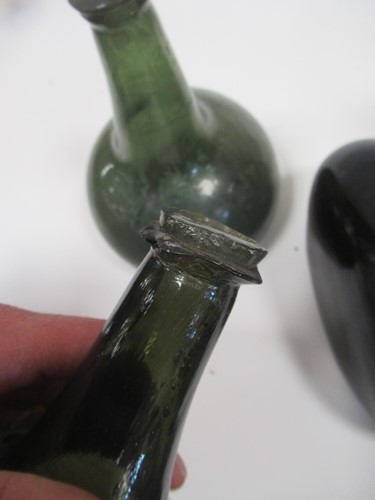 Lot 9 - A group of 18th century bottles, onion shaped...