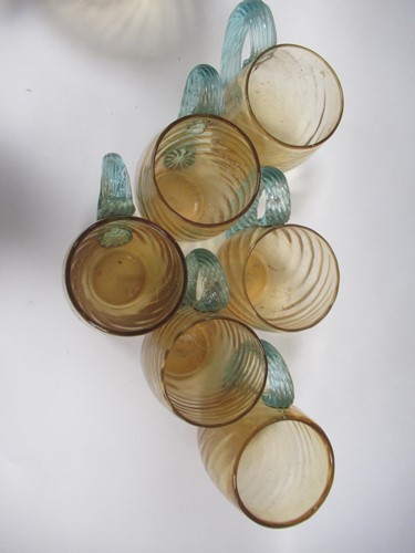 Lot 8 - A hand blown swirled amber glass jug or...