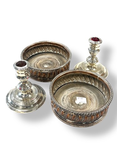 Lot 274 - A pair of loaded silver library candlesticks,...