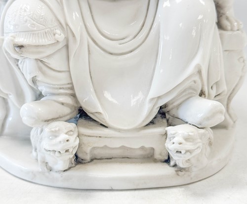 Lot 48 - A Dehua seated figure of Guandi, Daoist God of War, mark of He Chaozong