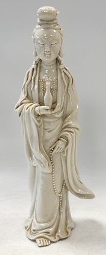 Lot 49 - A Chinese Dehua standing figure of Guanyin, Goddess of Mercy, 18th/19th century