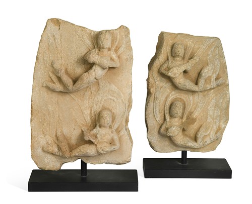 Lot 50 - Two similar Chinese stone fragments of flying apsaras, possibly Tang Dynasty