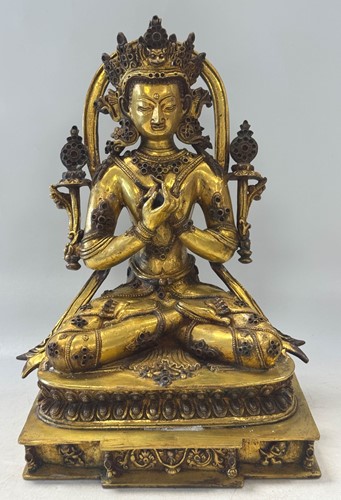 Lot 91 - A Nepalese gilt bronze seated figure of Vajradhara, in 18th century style