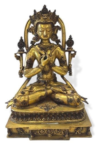 Lot 91 - A Nepalese gilt bronze seated figure of Vajradhara, in 18th century style