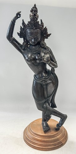 Lot 92 - An Indo-Nepalese bronze large dancing figure of a Tara, Bodhisattva of Compassion
