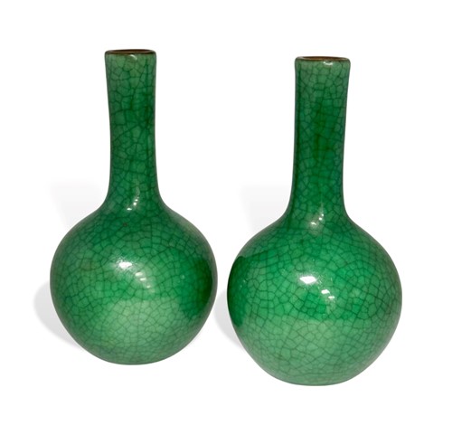 Lot 46 - A pair of Chinese green monochrome small bottle vases, Qing Dynasty, 19th century