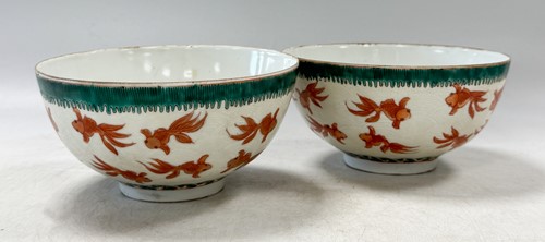 Lot 47 - A pair of Chinese porcelain fish and wave bowls, Guangxu mark but probably Republic