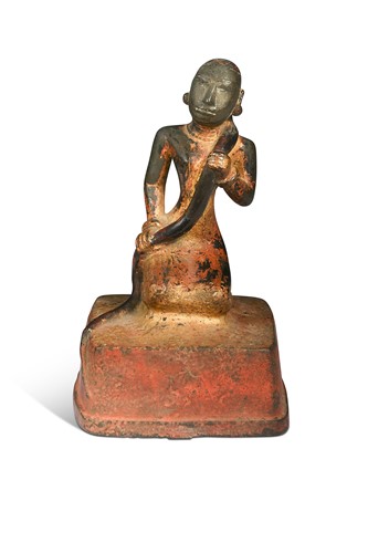Lot 44 - A Burmese painted and partly gilded kneeling figure, 18/19th century