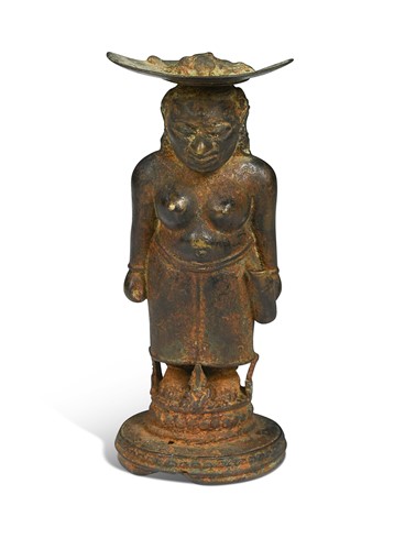 Lot 42 - A Javanese Majapahit period Indonesian bronze and iron figure of a half nude woman, 14th century