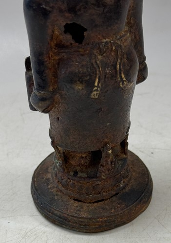 Lot 42 - A Javanese Majapahit period Indonesian bronze and iron figure of a half nude woman, 14th century