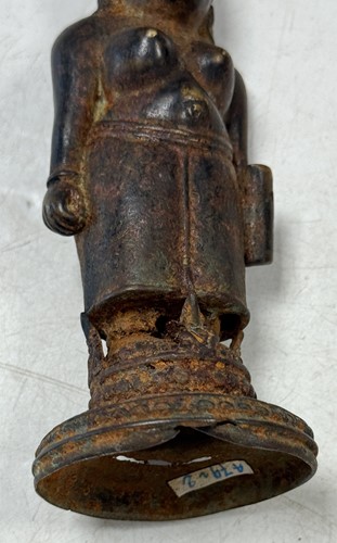Lot 42 - A Javanese Majapahit period Indonesian bronze and iron figure of a half nude woman, 14th century
