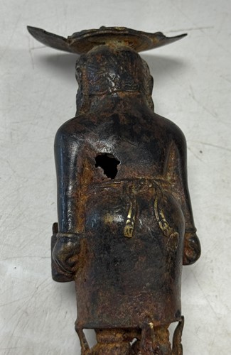 Lot 42 - A Javanese Majapahit period Indonesian bronze and iron figure of a half nude woman, 14th century