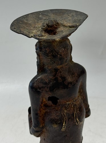Lot 42 - A Javanese Majapahit period Indonesian bronze and iron figure of a half nude woman, 14th century