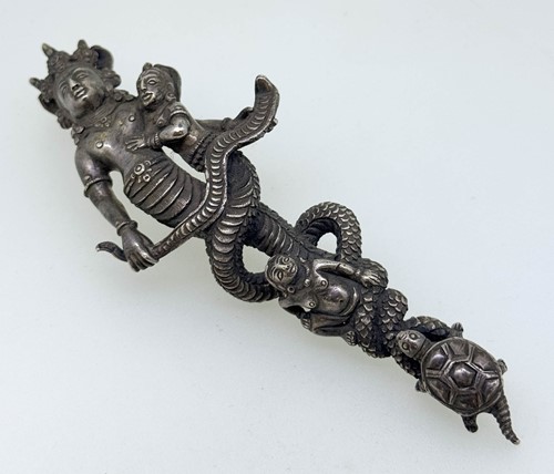 Lot 52 - A Tibetan white metal mother and daughter mermaid figure, 19th century