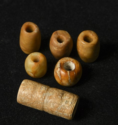 Lot 16 - A group of six jade beads, China, Liangzhu Culture, circa 3300-2300 BCE