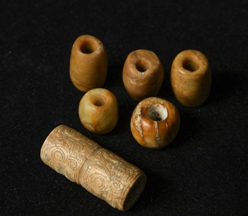Lot 16 - A group of six jade beads, China, Liangzhu Culture, circa 3300-2300 BCE