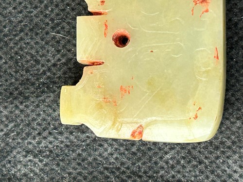 Lot 18 - A Chinese carved jade ornament, probably Shang Dynasty, circa 600-1046 BCE