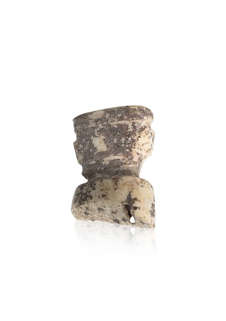 Lot 19 - A Chinese carved white jade ornament, Lingjiatan, Culture (circa 3800-3300 BCE)