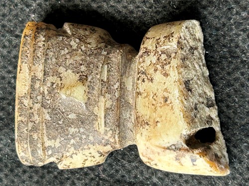 Lot 19 - A Chinese carved white jade ornament, Lingjiatan, Culture (circa 3800-3300 BCE)