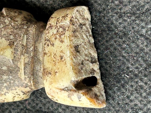 Lot 19 - A Chinese carved white jade ornament, Lingjiatan, Culture (circa 3800-3300 BCE)