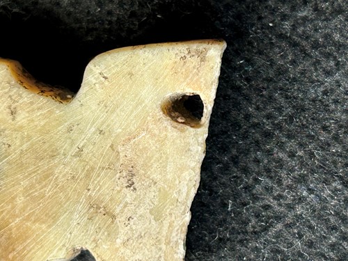 Lot 19 - A Chinese carved white jade ornament, Lingjiatan, Culture (circa 3800-3300 BCE)