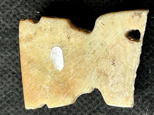 Lot 19 - A Chinese carved white jade ornament, Lingjiatan, Culture (circa 3800-3300 BCE)