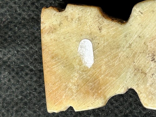 Lot 19 - A Chinese carved white jade ornament, Lingjiatan, Culture (circa 3800-3300 BCE)