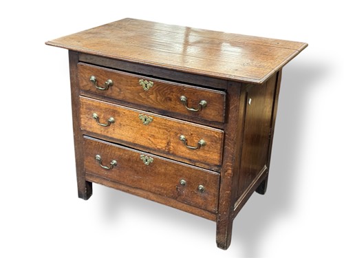 Lot 531 - An 18th century oak three drawer chest, with...