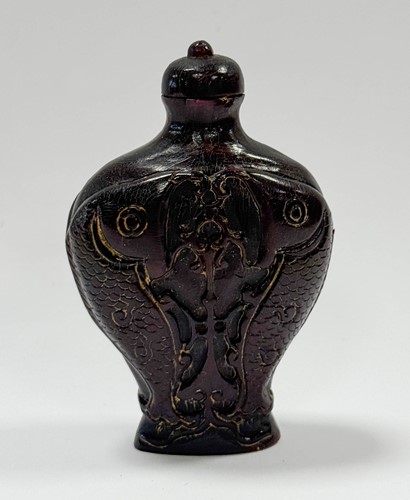 Lot 68 - A Chinese carved ox-horn carp snuff bottle, Qing Dynasty, 19th century