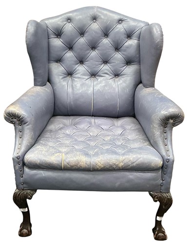 Lot 596 - A George III style mahogany framed wing back armchair