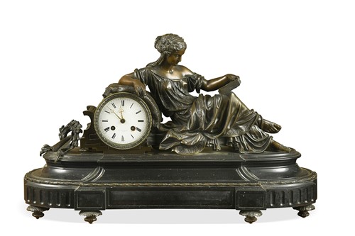 Lot 568 - A French bronze and black marble mantel clock, 19th century
