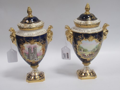 Lot 233 - A pair of commemorative vases and covers,...