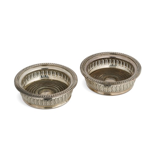 Lot 469 - A pair of Elizabeth II silver bottle coasters