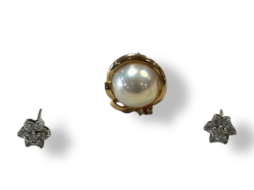 Lot 325 - A single mabe pearl ear stud, stamped '14K',...