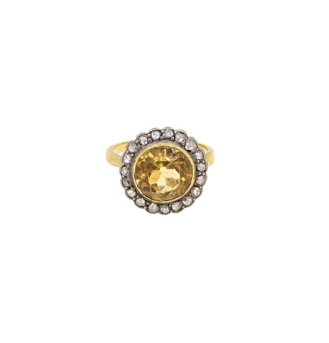 Lot 79 - A citrine and diamond cluster ring