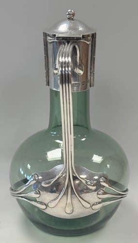 Lot 250 - Charles Robert Ashbee (1863-1942) for the Guild of Handicraft, a rare silver and glass wine decanter