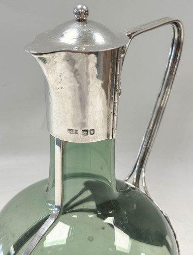 Lot 250 - Charles Robert Ashbee (1863-1942) for the Guild of Handicraft, a rare silver and glass wine decanter