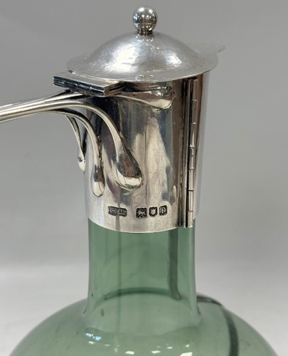 Lot 250 - Charles Robert Ashbee (1863-1942) for the Guild of Handicraft, a rare silver and glass wine decanter