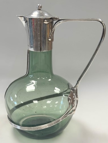 Lot 250 - Charles Robert Ashbee (1863-1942) for the Guild of Handicraft, a rare silver and glass wine decanter