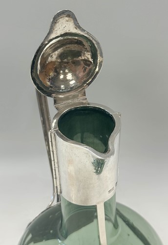 Lot 250 - Charles Robert Ashbee (1863-1942) for the Guild of Handicraft, a rare silver and glass wine decanter
