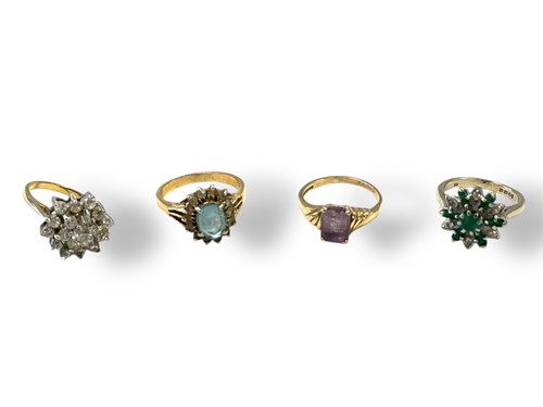 Lot 310 - Four stone set rings, one hallmarked 18ct gold...