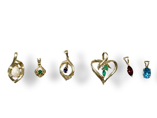 Lot 328 - Six stone set pendants assessed as 14ct gold,...