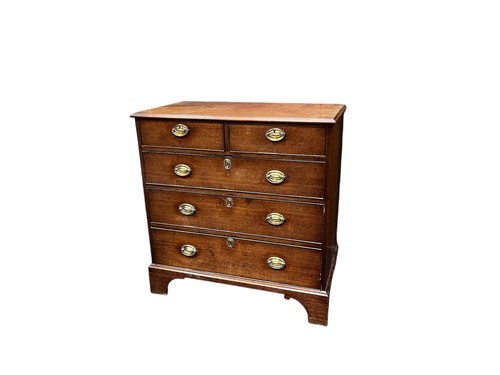 Lot 594 - A 19th century mahogany chest, of two short...