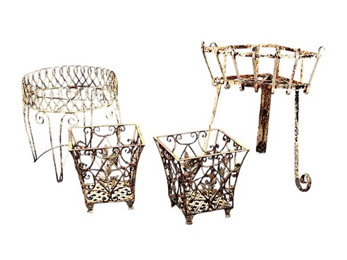 Lot 688 - A wrought metal white painted corner planter,...