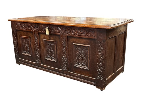 Lot 533 - An 18th century carved oak coffer, two plank...